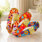 Colorful dog collar with cartoon character design on a soft surface.