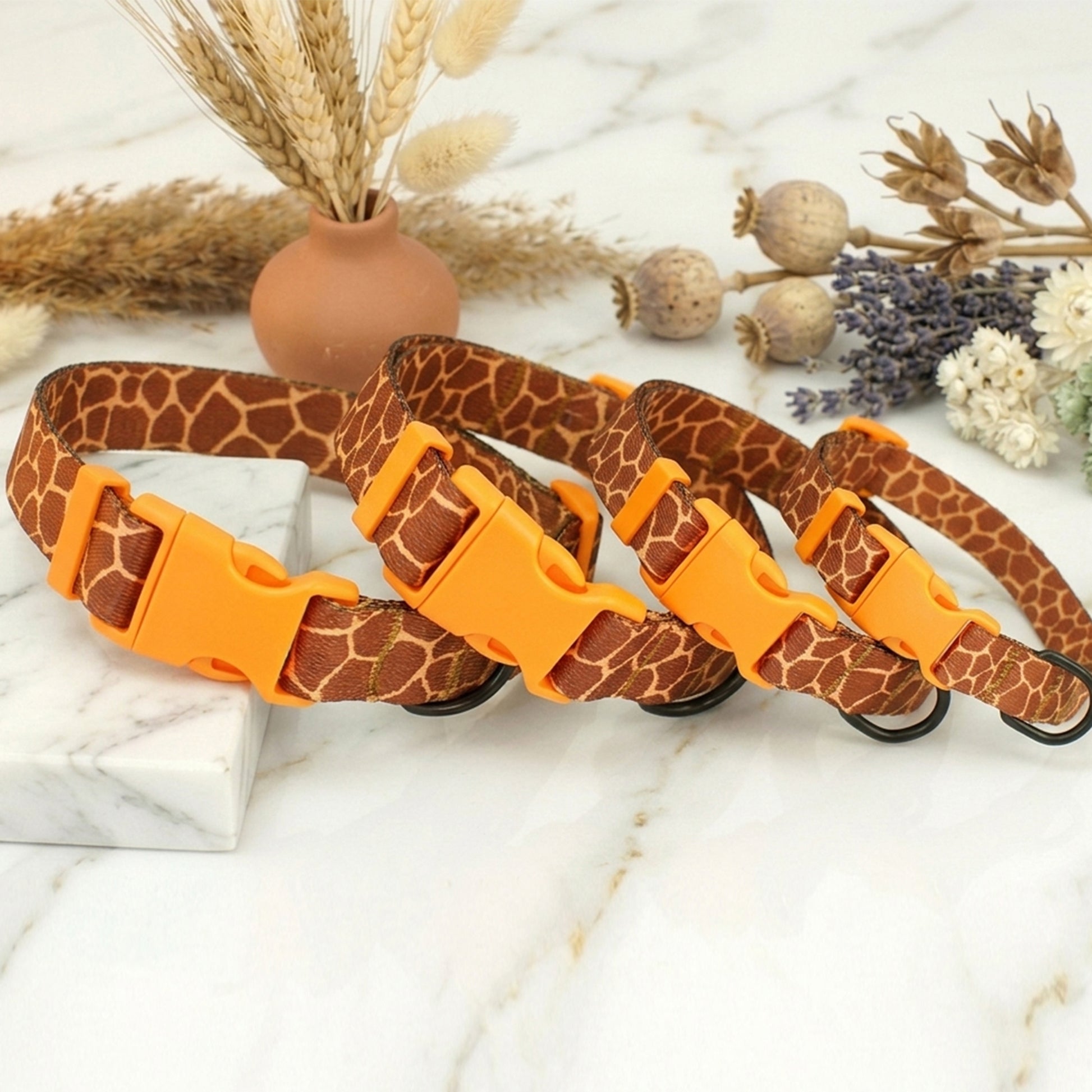 Animal print dog collar with custom ID tag – side view on marble surface