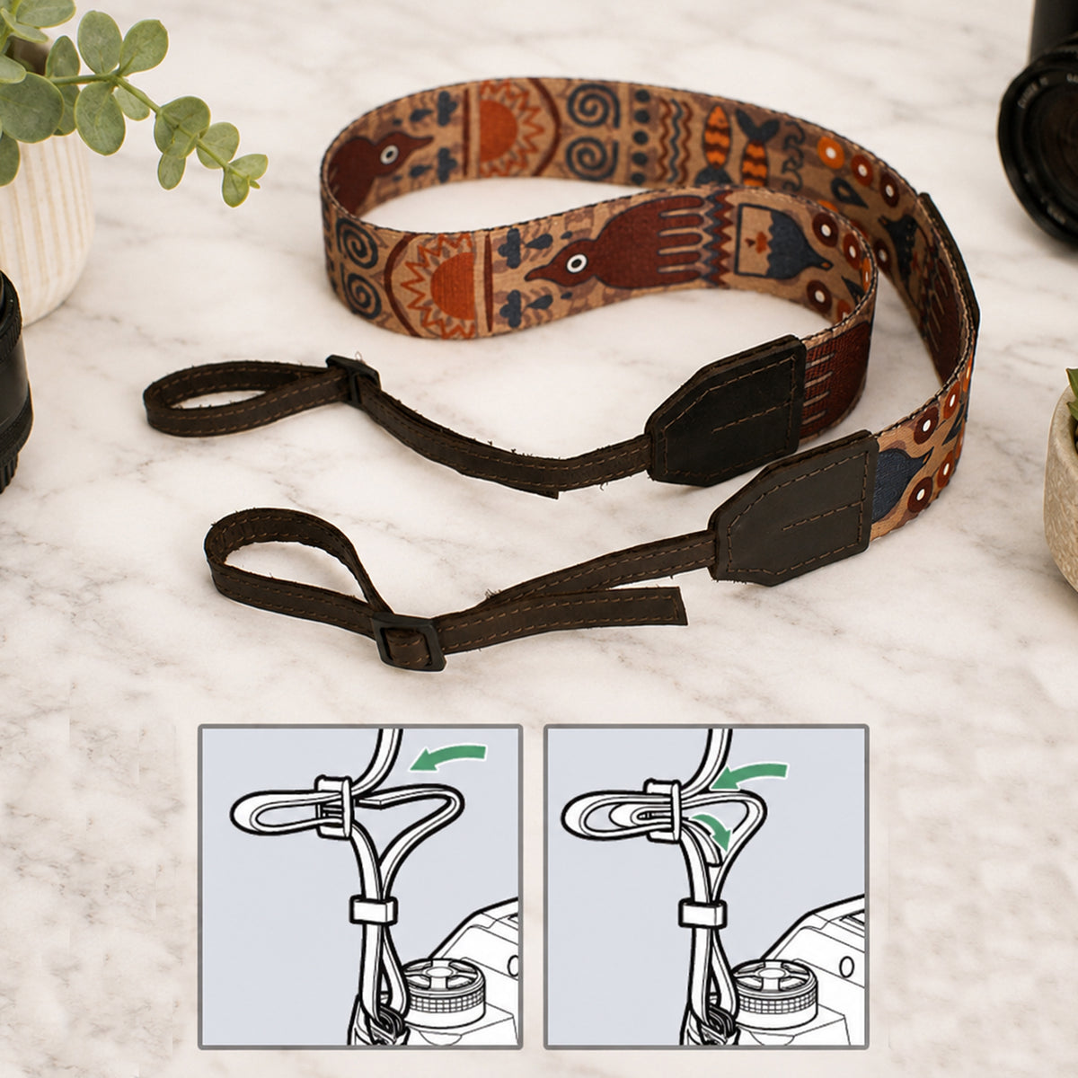 Decorative camera strap with intricate patterns on a light surface.