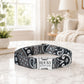 Dog collar with 'Rocky' engraved on a marble surface in a home setting