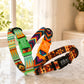 Colorful dog collars with geometric patterns on a light surface.