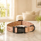 Personalized dog collar with pattern and name 'Stella' on a marble surface.