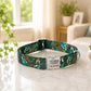 Decorative dog collar with a floral pattern on a marble surface, with a blurred indoor background.