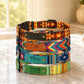 Colorful dog collars with engraved names on a marble surface