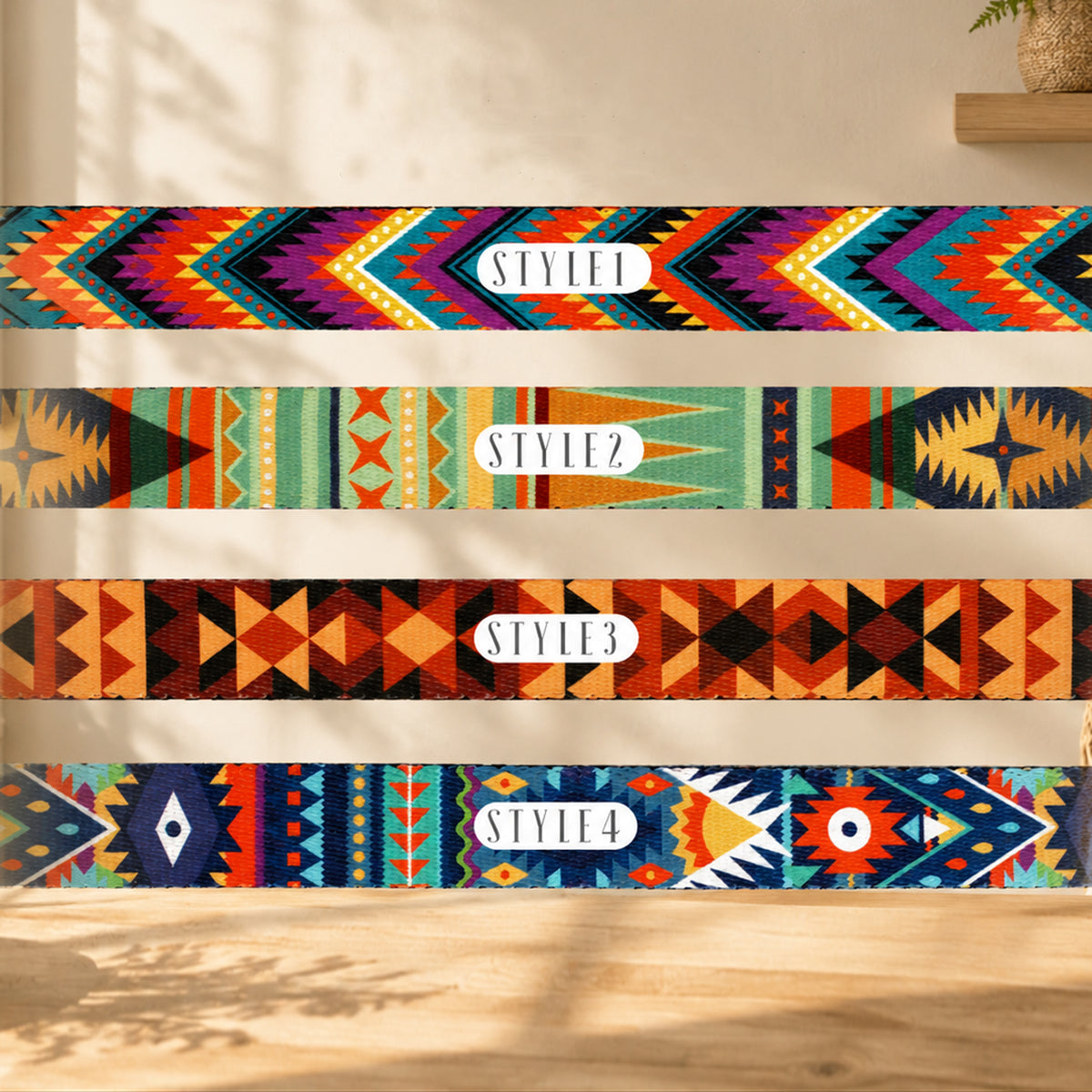Four colorful patterned belts with 'STYLEZ' branding on a wooden surface.