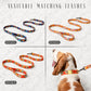 Four colorful dog leashes with a dog wearing one of them on a light gray background.