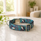 Dog collar with a colorful pattern on a marble surface