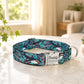 Colorful dog collar with 'Buddy' engraved on a marble surface