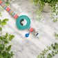 Set of artistic AirTag cat collars with integrated GPS safety and breakaway buckles