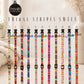 Collection of colorful tribal stripe pet collars with decorative elements on a white background.