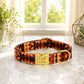 Dog collar with geometric pattern and gold buckle on a marble surface