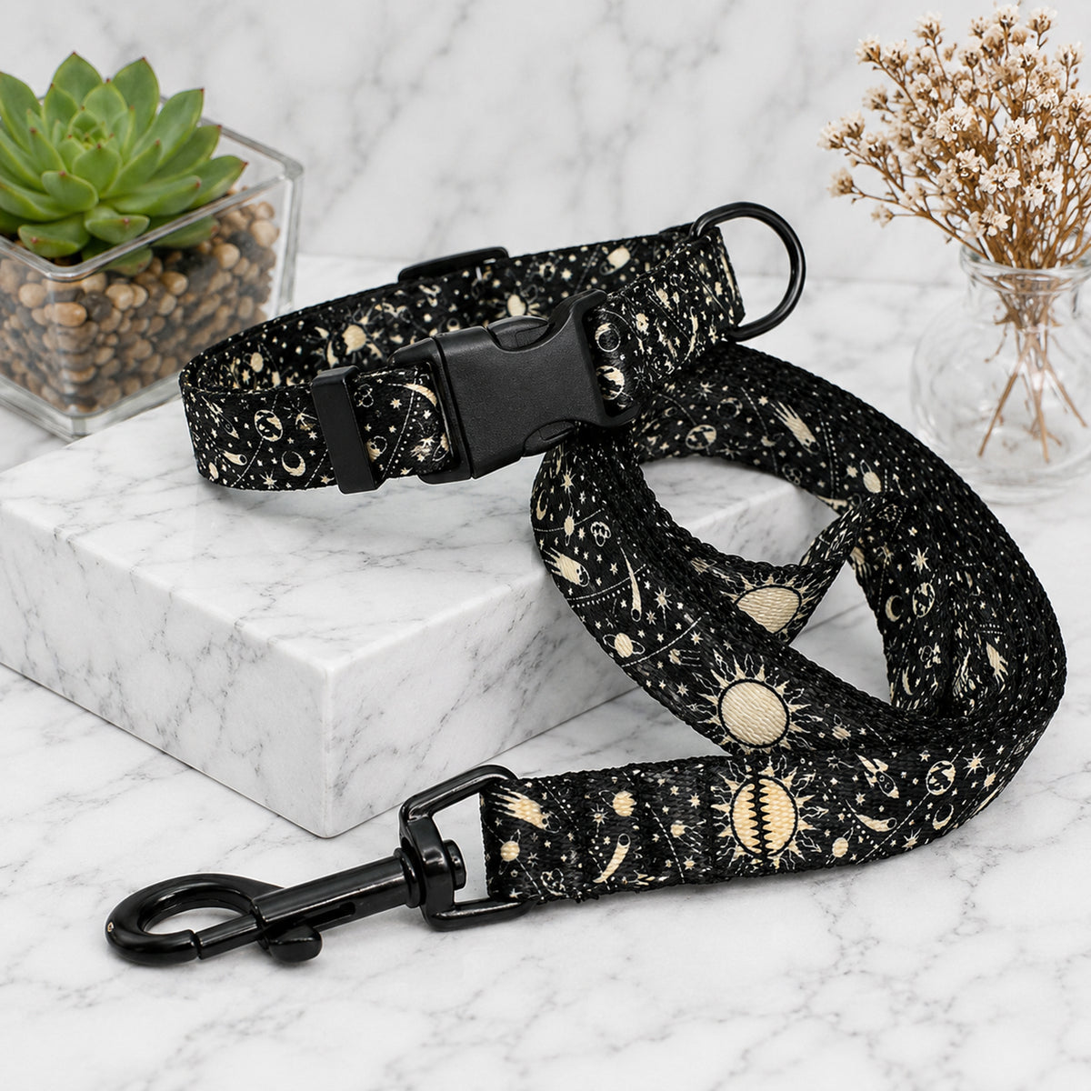 Dog collar and leash with celestial pattern on a marble surface