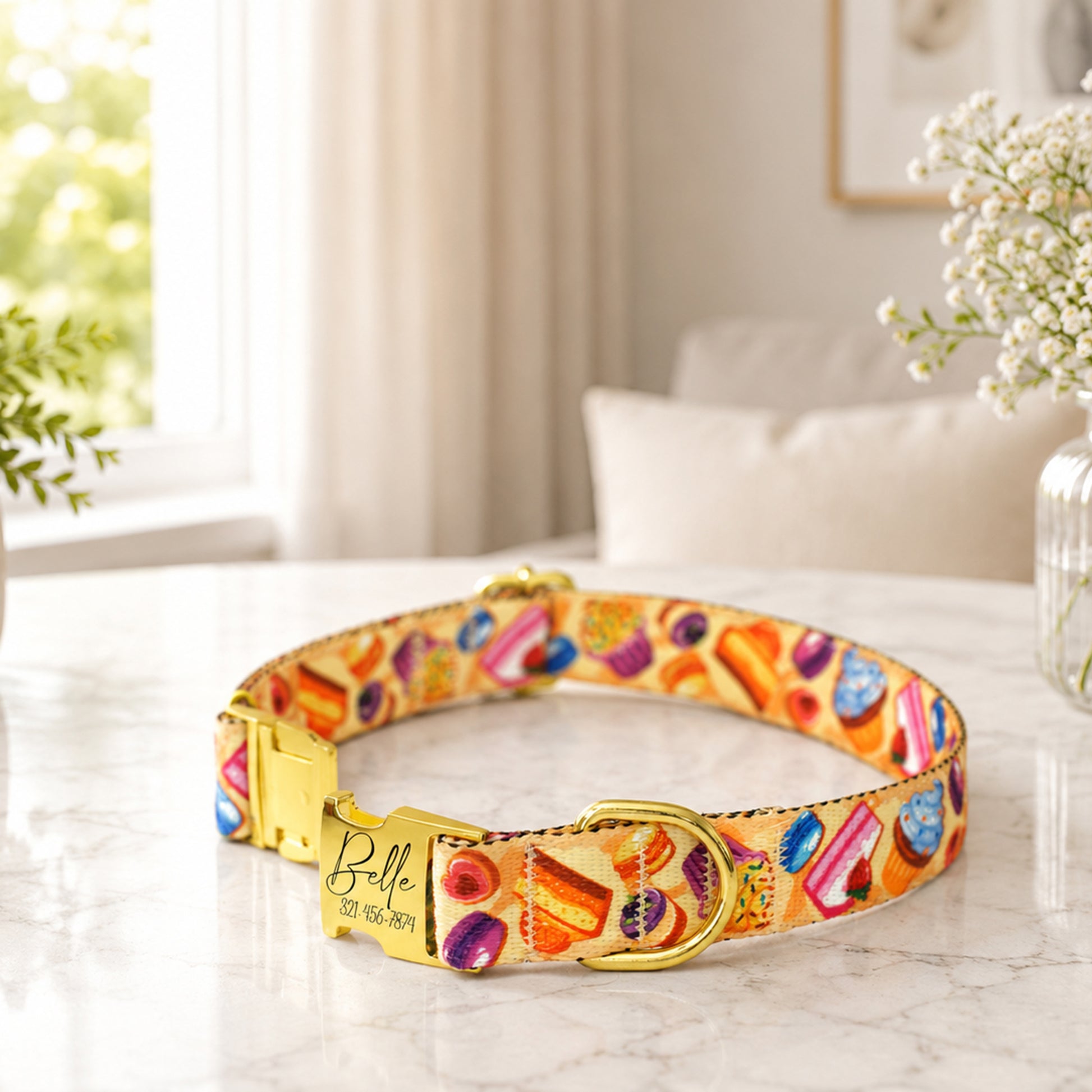 Sweet Treats dog collar – custom engraved buckle close-up on marble surface