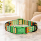 Green patterned dog collar with 'Sophie I'm chipped' text on a marble surface.