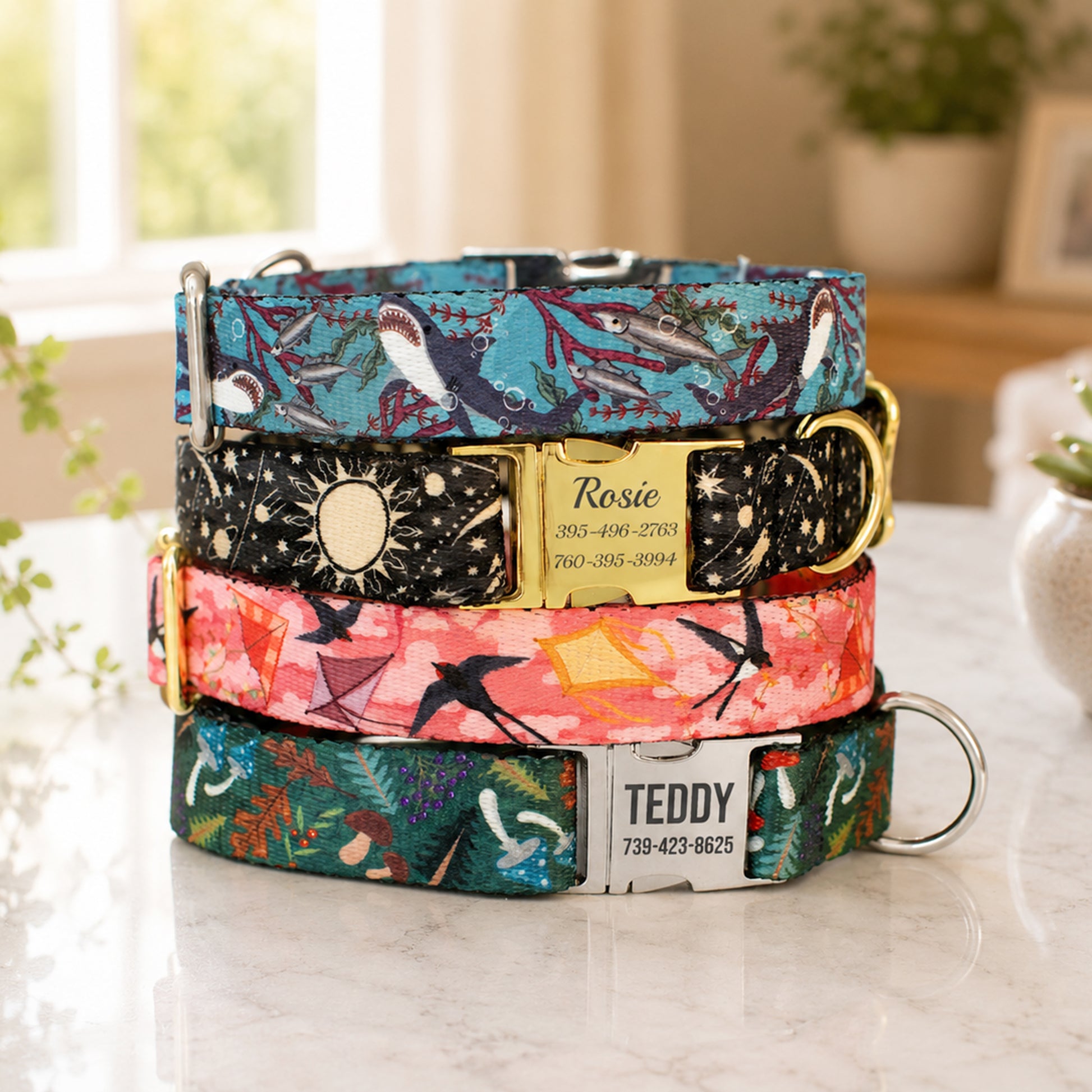 Stack of colorful dog collars with engraved names on a light surface.