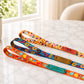 Colorful dog leashes with names on a marble surface