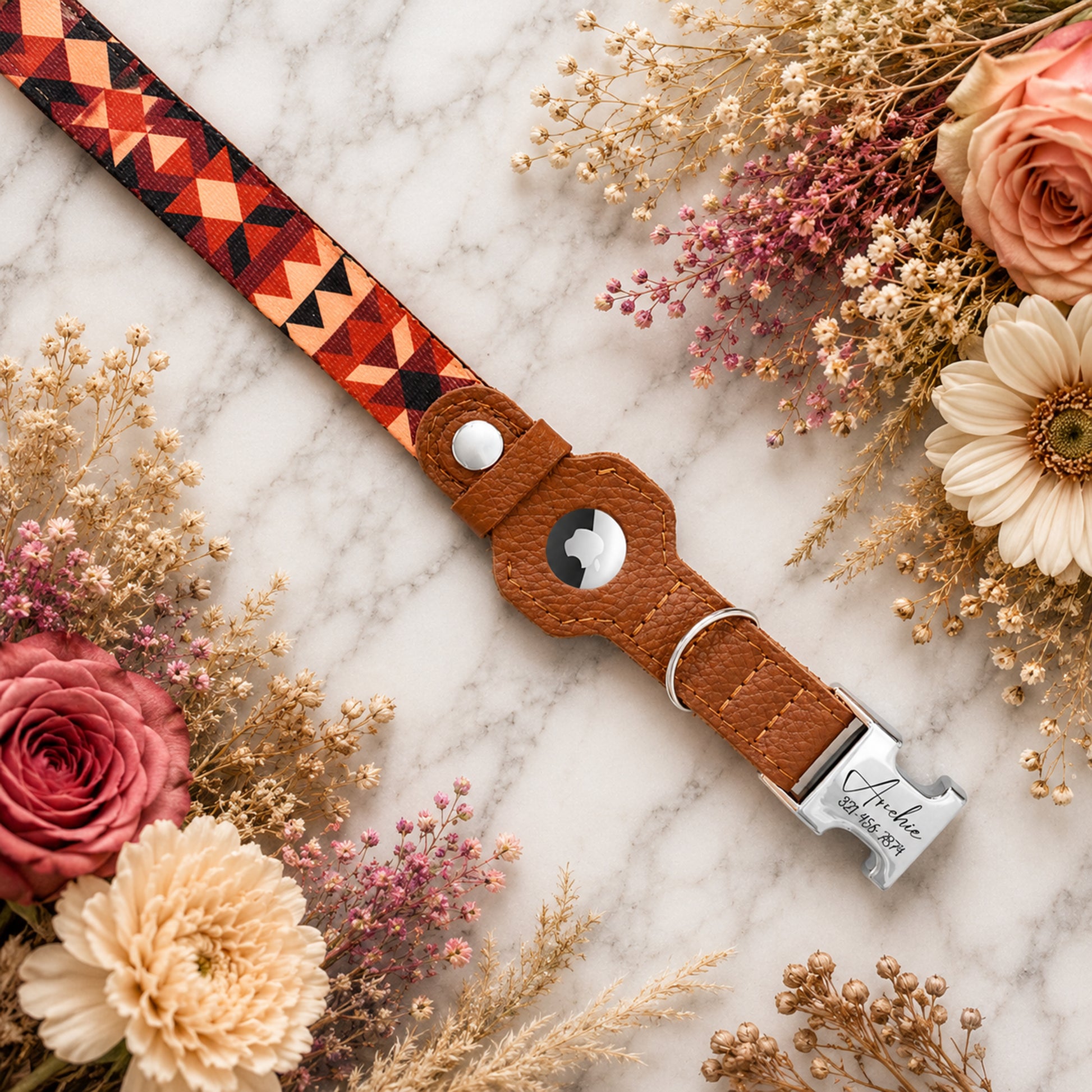 Leather dog collar with geometric pattern on a marble surface with flowers