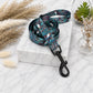 Patterned dog leash on a marble surface with decorative elements