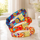 Colorful dog collars with decorative patterns on a light surface.