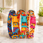 Three colorful dog collars with branded clasps on a marble surface.