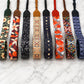 Collection of colorful patterned straps on a marble surface
