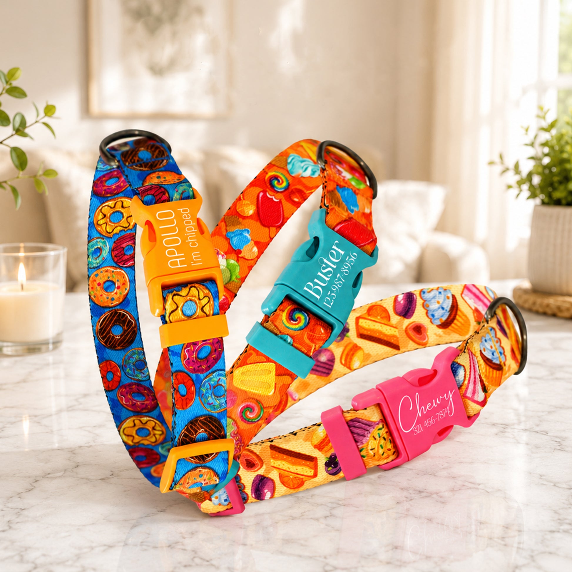 Colorful dog collars with various patterns on a marble surface.