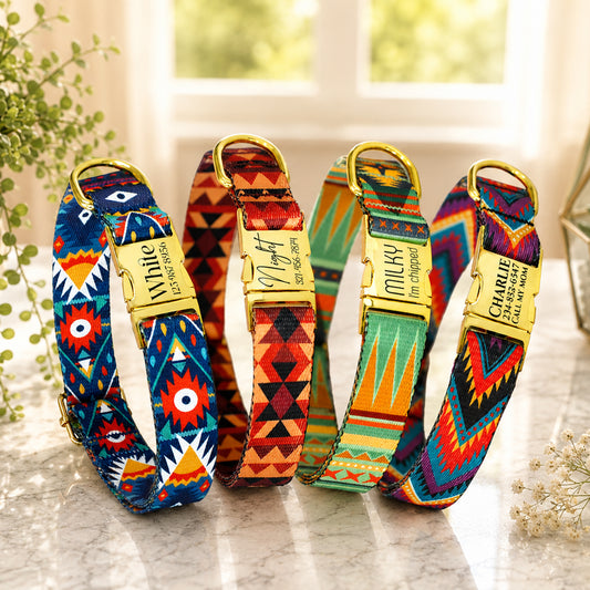 Set of colorful dog collars with gold hardware on a marble surface.