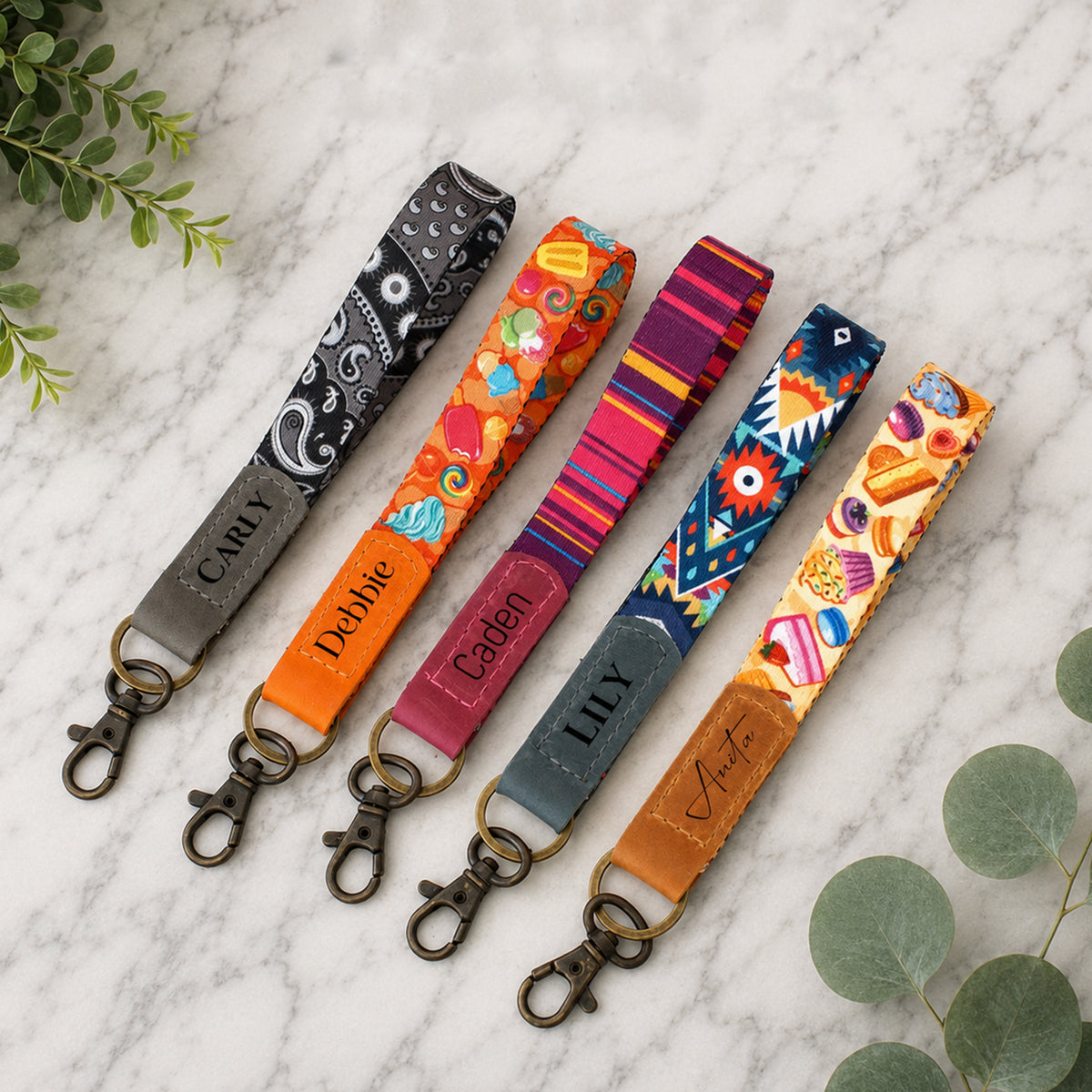Colorful lanyards with name tags on a marble surface