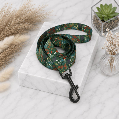 Green floral-patterned dog leash on a marble stand with decorative elements.